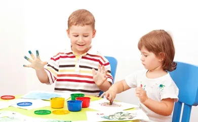 brother and the sister draw finger-type paints